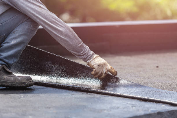 Professional Basement Waterproofing technician working in Harlan, KY